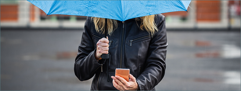 Woman holding blue umbrella mobile