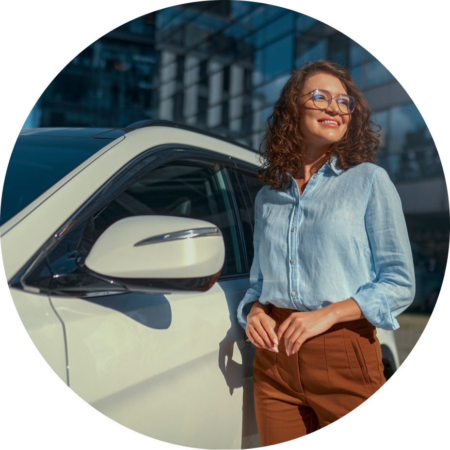 smiling lady standing by car