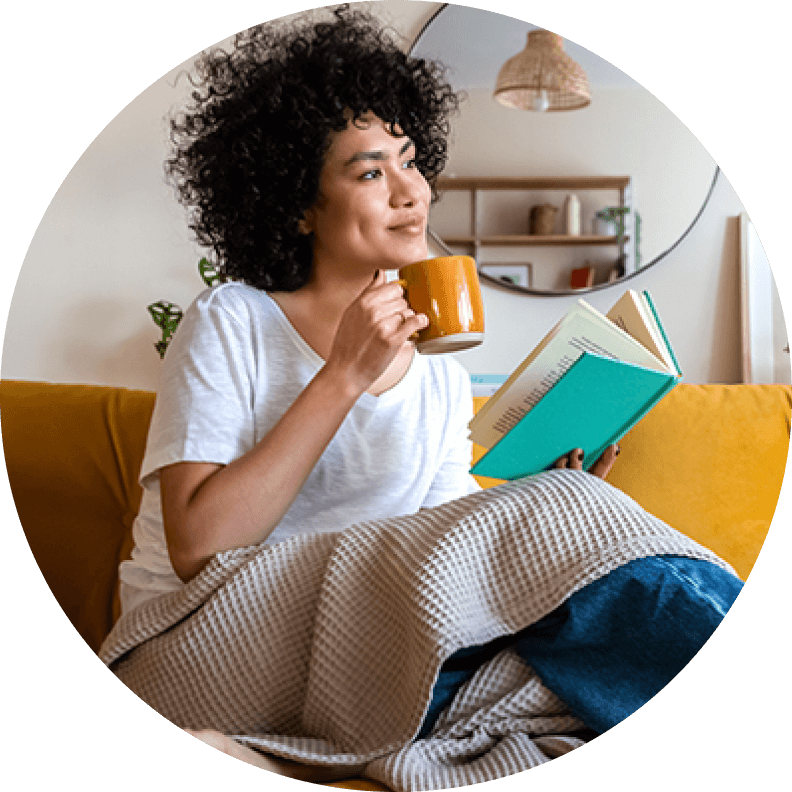 young lady with coffee and book