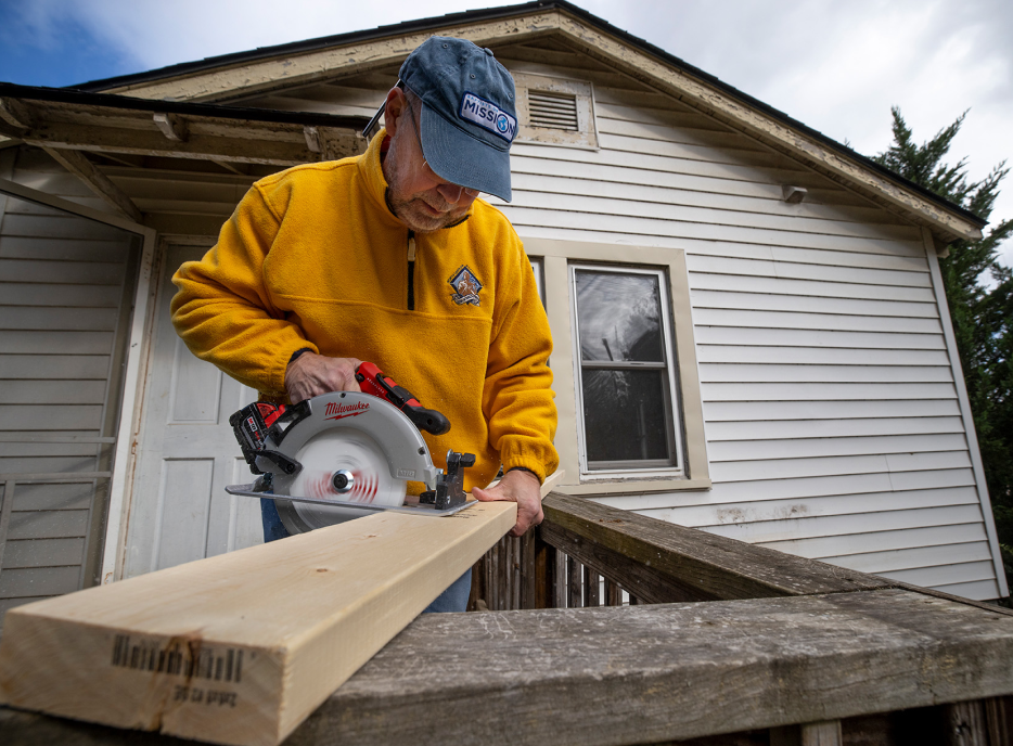 Man cutting wood