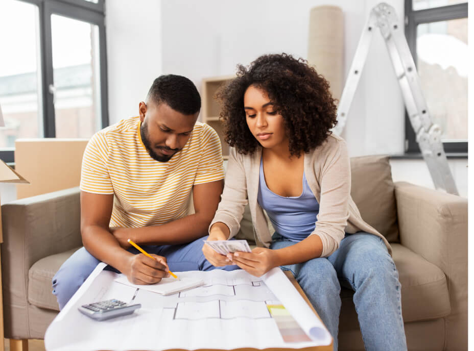 couple on couch with calculator