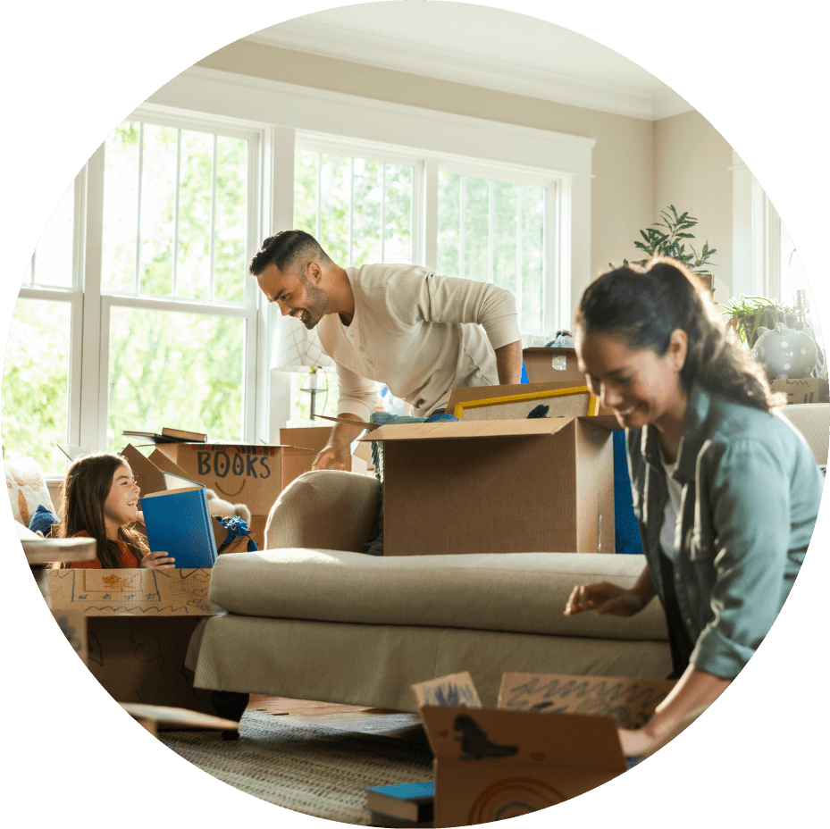 family opening moving boxes