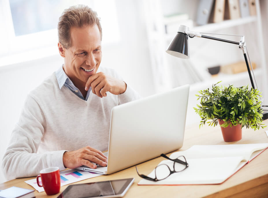 older gentleman on computer at desk