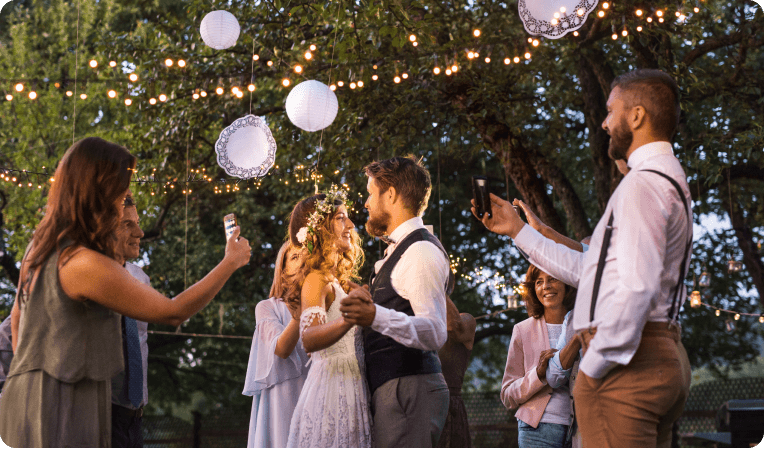 happy people dancing at wedding