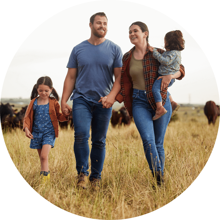 Family of four walking hand in hand