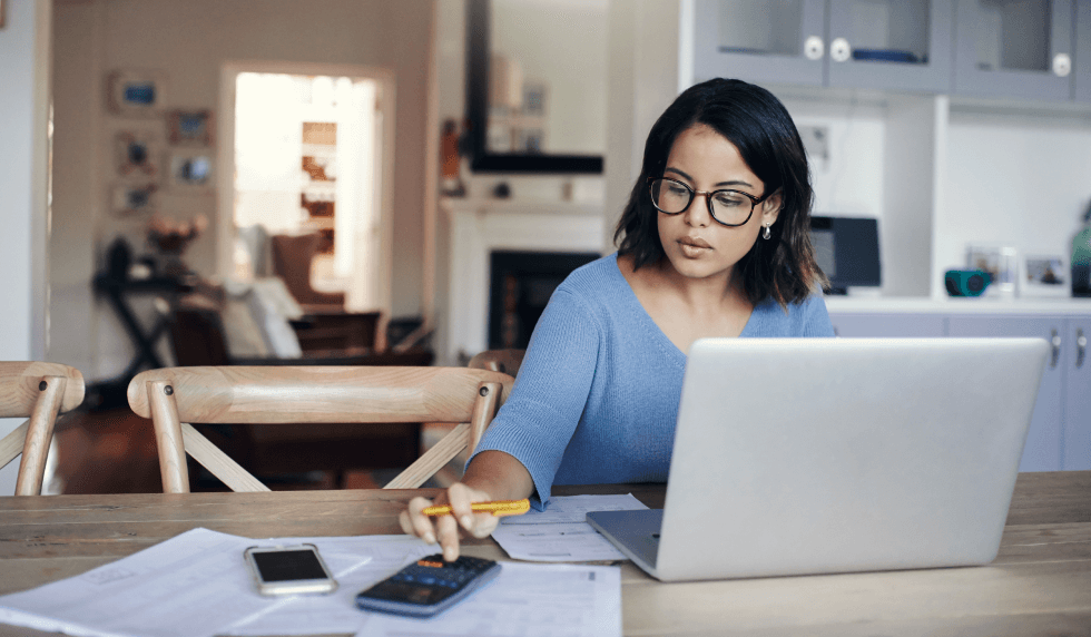 lady in kitchen calculating