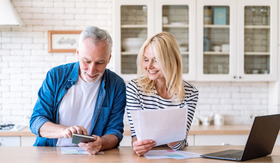 Man and woman working on their budget together