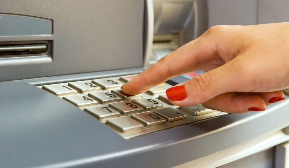 Hand using ATM machine