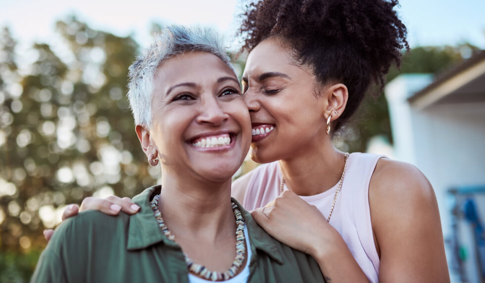 happy daughter hugging mother