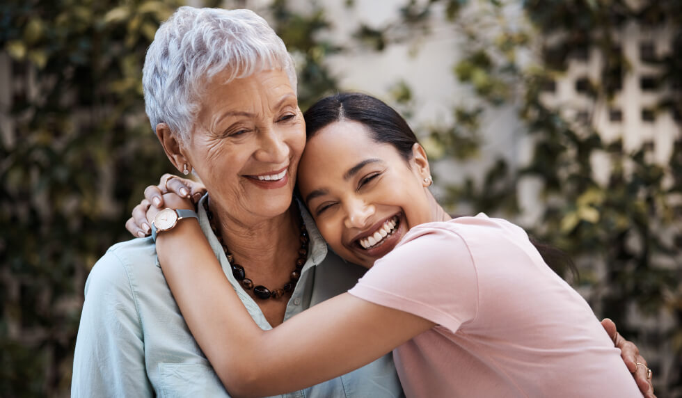 grandma and granddaughter hugging