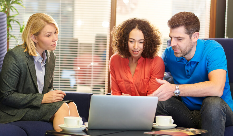 Couple speaking with financial representative