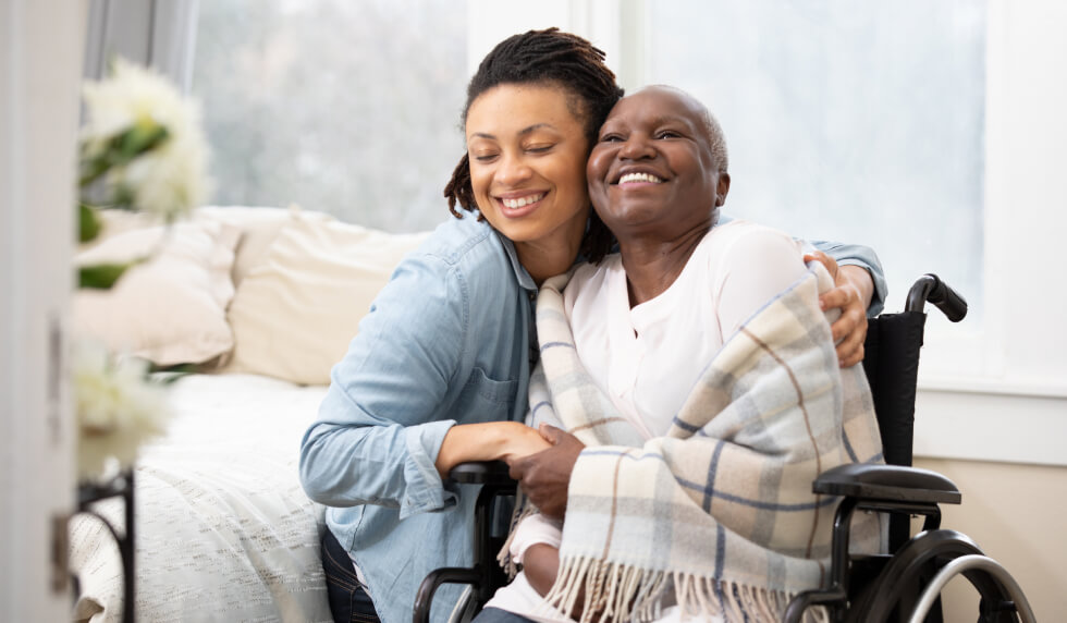 Elderly woman in wheel chair with guardian