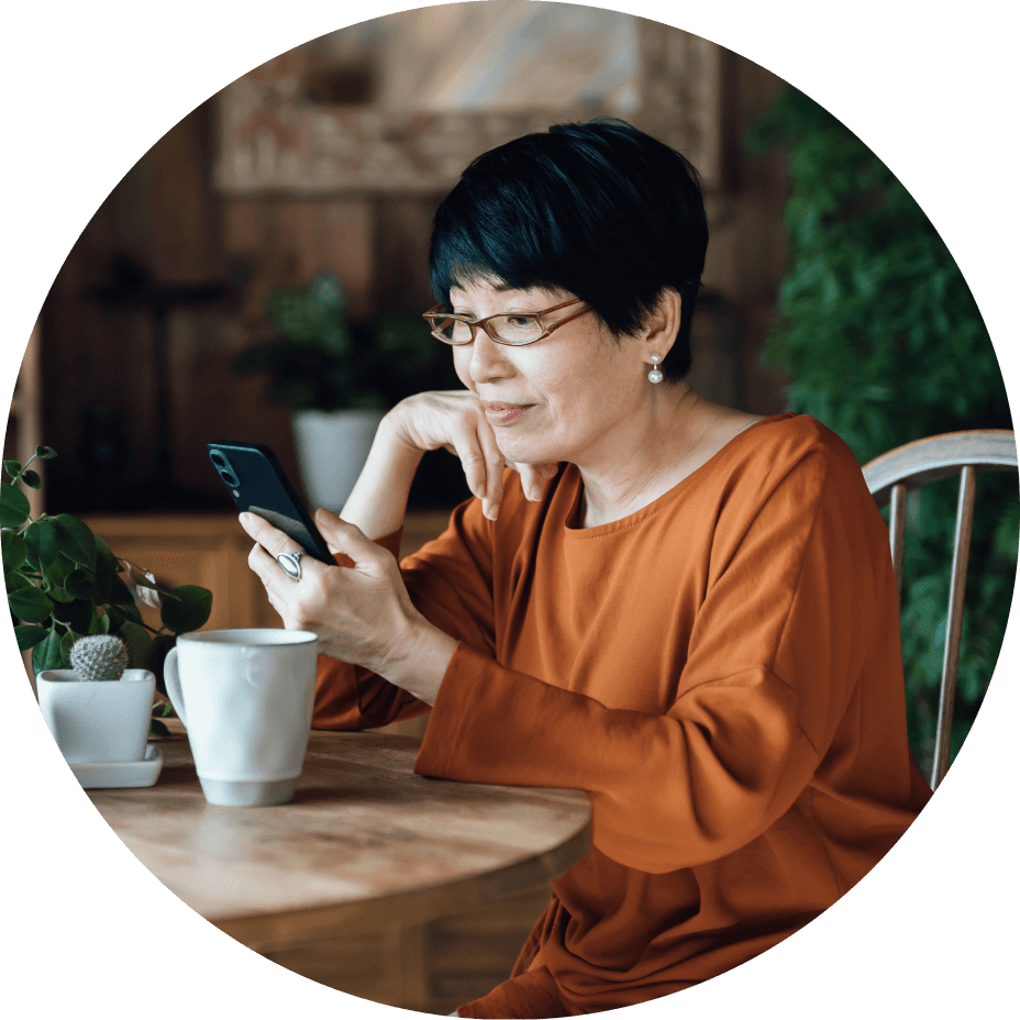 woman using cell phone in restaurant